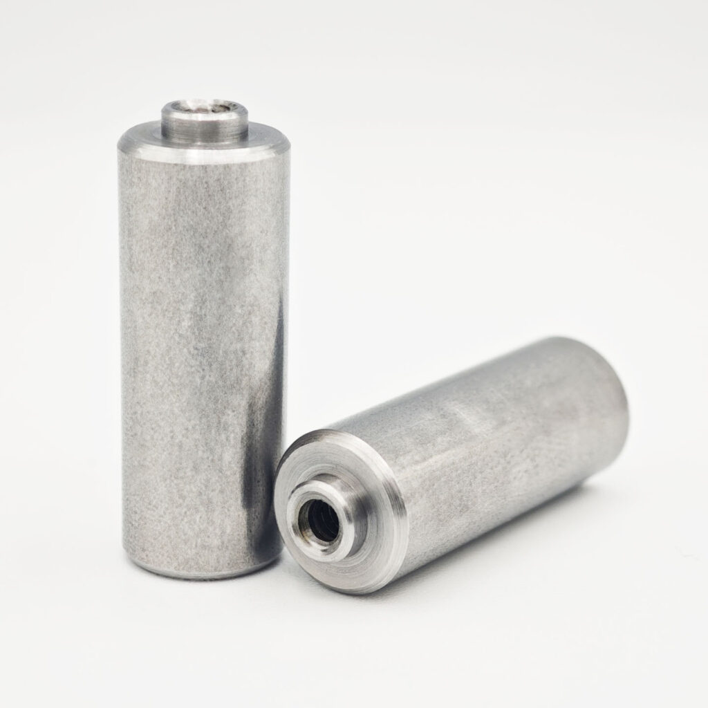 Stainless steel nut stud with internal thread and cylindrical locating pin