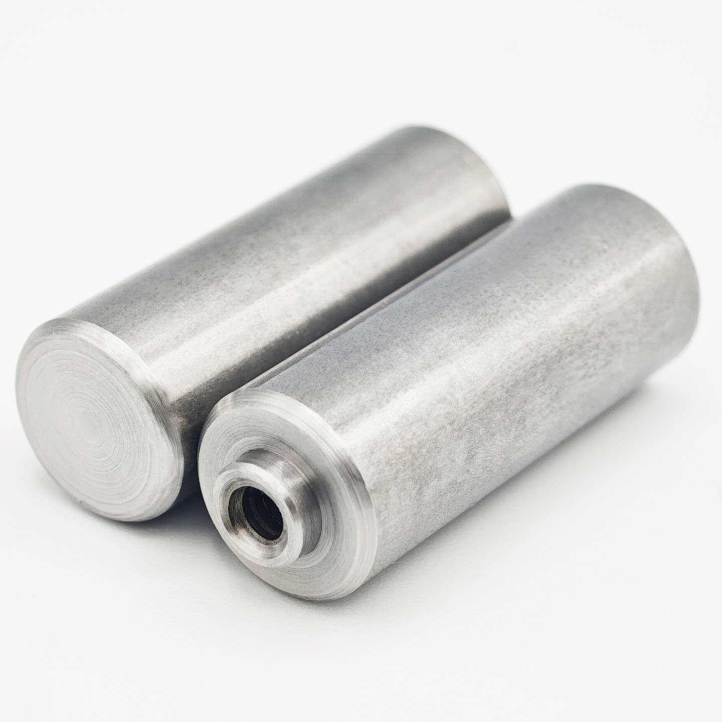 Stainless steel nut stud with internal thread and cylindrical locating pin