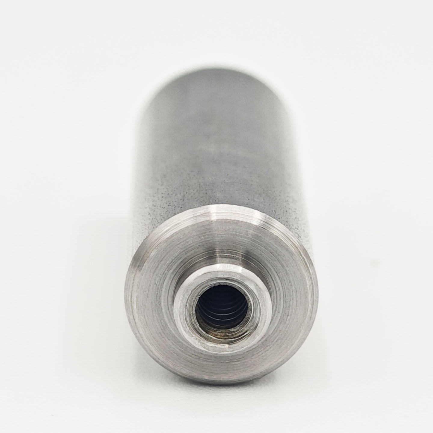 Stainless steel nut stud with internal thread and cylindrical locating pin